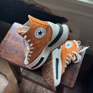 Light wear. Converse sneaker Run Star Legacy Hi sneakers in orange.  Light wear